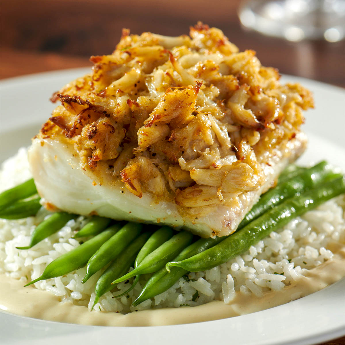Burtons crab crusted haddock atop fresh green beans and fluffy rice at Framingham location
