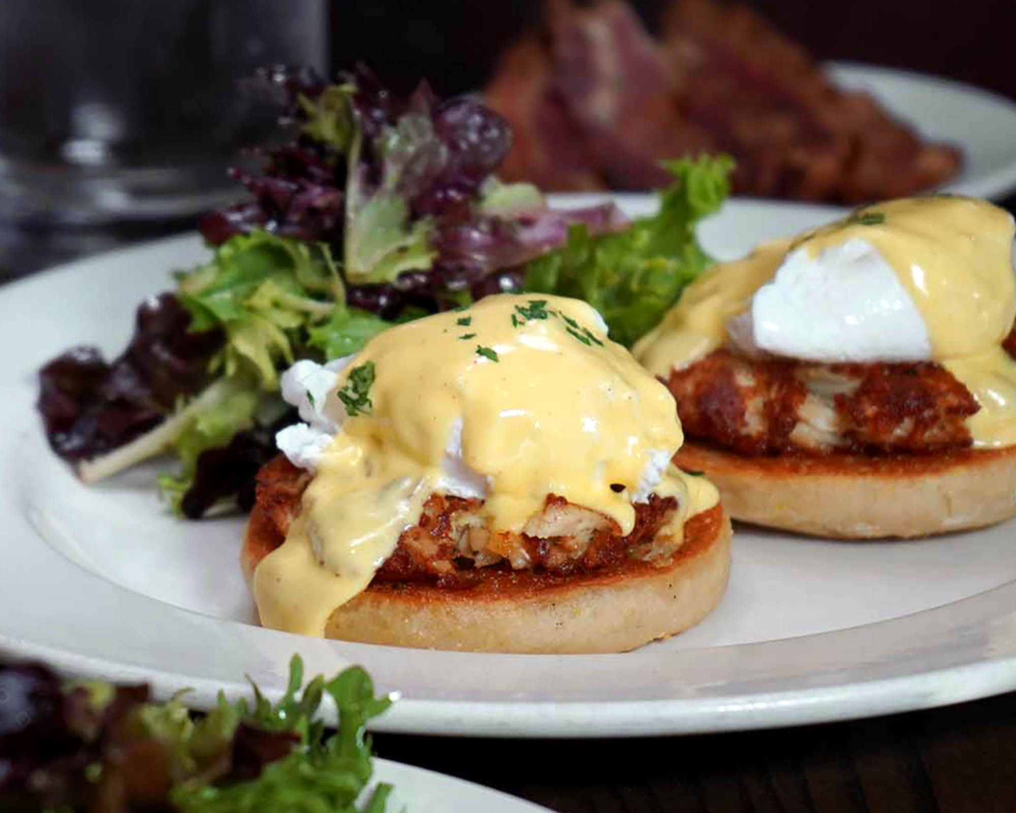 Tasty crab cake eggs Benedict at select Burtons Grill locations