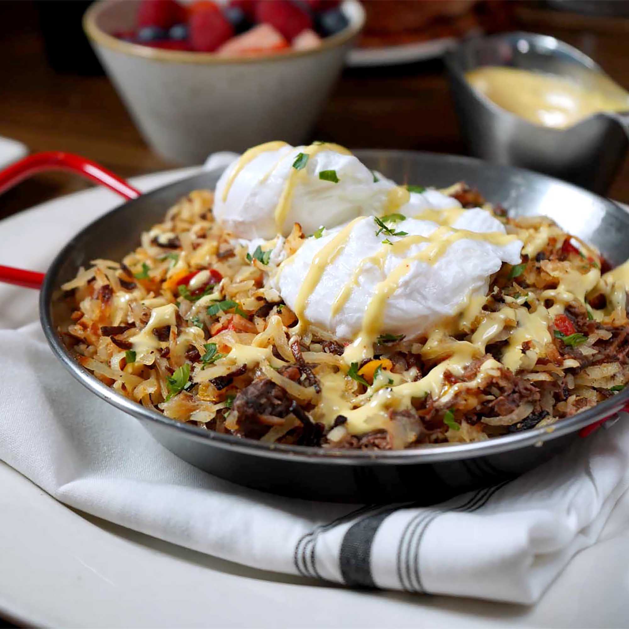 Short rib hash served in a sizzling pan for Burtons weekend brunch